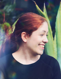 Portrait of smiling young woman looking away