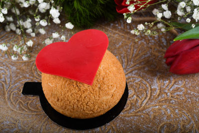 High angle view of heart shape cake on table