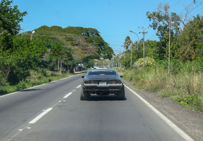 Car on road against clear sky