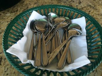 High angle view of spoons in marble floor