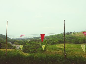 View of grassy field against sky