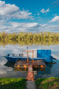 Blue and white boat on river