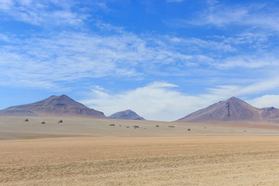 Scenic view of arid landscape against sky