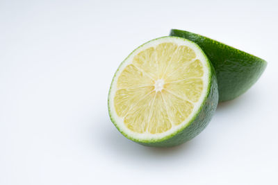 Close-up of lemon against white background