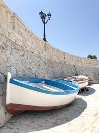 Boat moored against blue sky