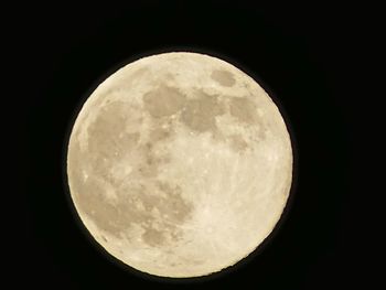 Low angle view of moon against sky at night