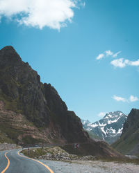 Scenic view of mountains against blue sky