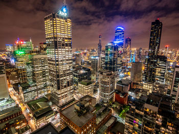 Aerial view of illuminated buildings in city at night