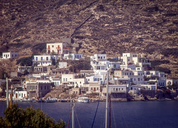 High angle view of buildings by sea