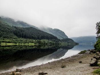 Scenic view of lake with mountains in background