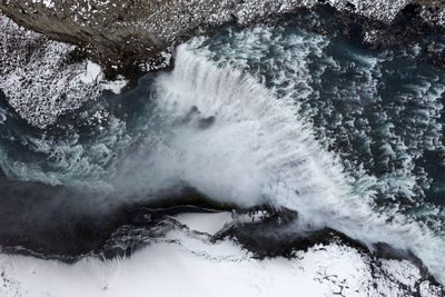 Aerial view of waterfall during winter