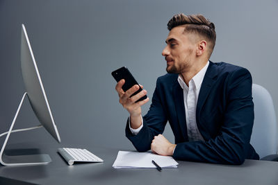 Portrait of young man using mobile phone