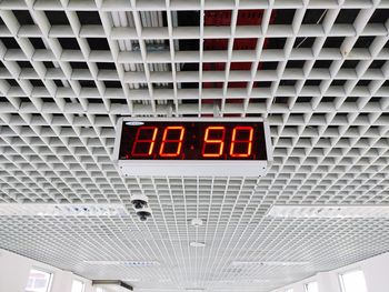Low angle view of information sign on ceiling