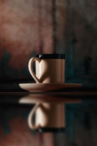 Close-up of coffee cup on table