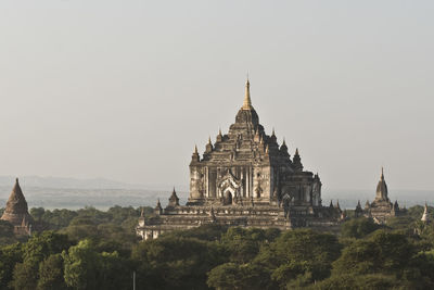 Historic temple amidst trees against sky