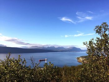 Scenic view of lake against cloudy sky