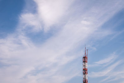 Low angle view of crane against sky