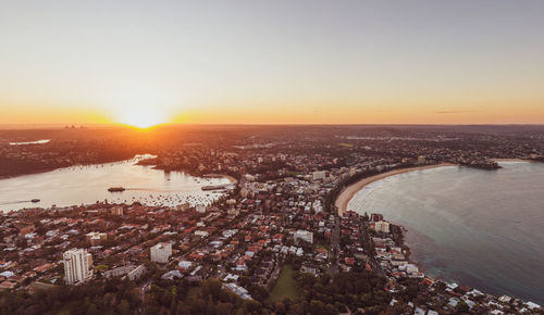 High angle view of city buildings during sunset