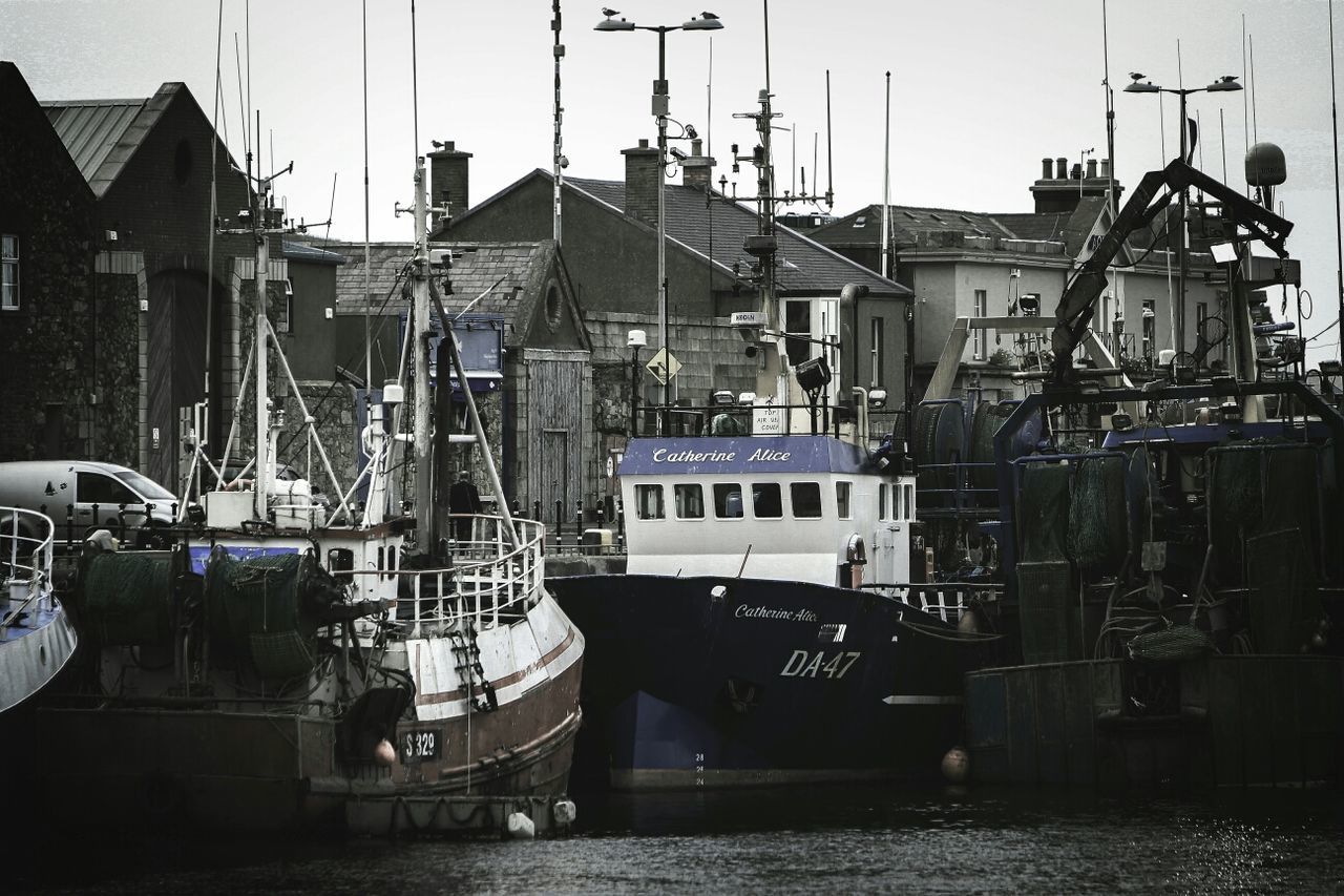 nautical vessel, transportation, mode of transport, moored, building exterior, harbor, built structure, architecture, boat, water, mast, industry, crane - construction machinery, day, waterfront, commercial dock, sky, outdoors, no people, construction site