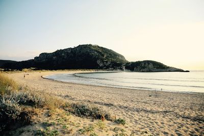 Scenic view of beach against clear sky