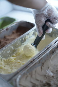 Close-up of hand scooping ice cream