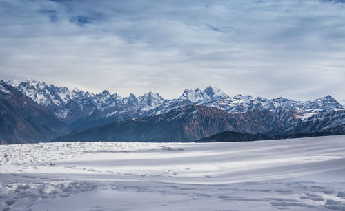 Scenic view of snowcapped mountains against sky