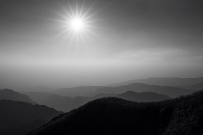 Scenic view of silhouette mountains against sky