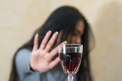 Portrait of woman drinking glass