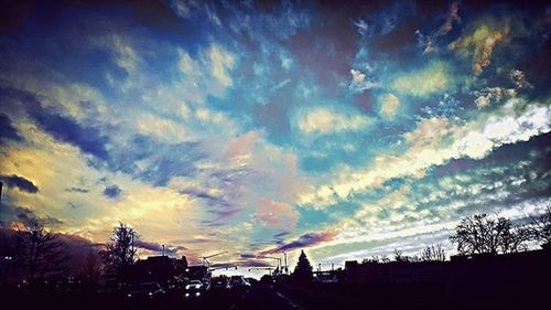 Scenic view of cloudy sky at sunset