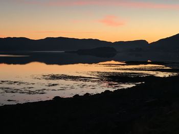 Scenic view of sea against sky at sunset