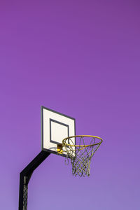 Street basketball hoop on background of vibrant sky. creative minimalistic photo. street basketball