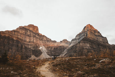 Rock formations on landscape against sky