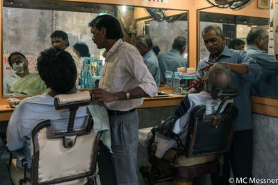 Men in shopping cart