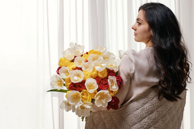 Young woman with bouquet