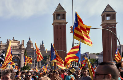 Group of people against buildings in city