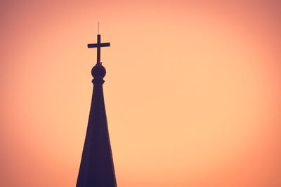 Low angle view of silhouette building against sky during sunset