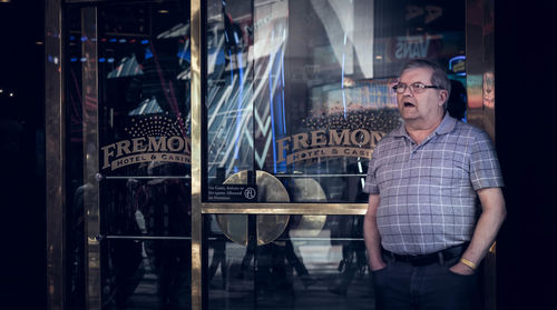 Full length of a man looking at restaurant