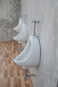 Toilet bowls in bathroom