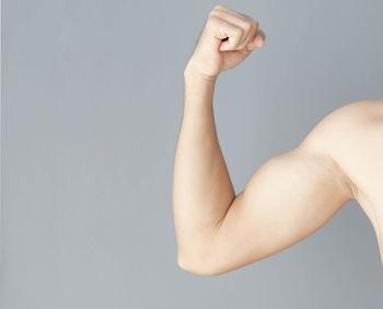 Close-up of woman hand against white background