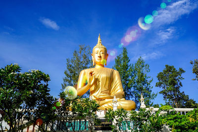 Low angle view of statue against sky