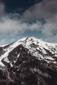 Scenic view of snow covered mountain against sky