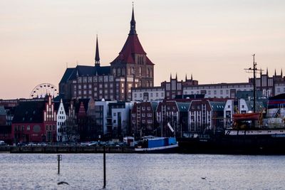 View of cityscape against sky during sunset