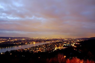 Aerial view of city lit up at night