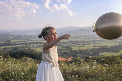 Full length of woman on field against sky