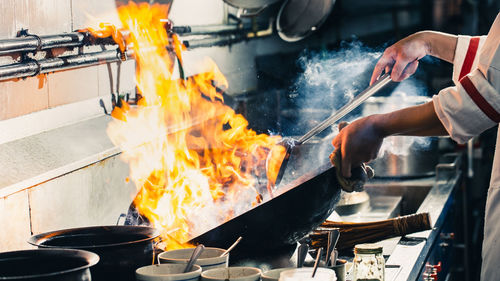 Man working on barbecue grill