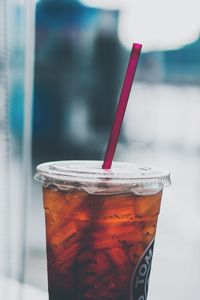 Close-up of drink in disposable glass