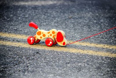 Close-up view of toy on road