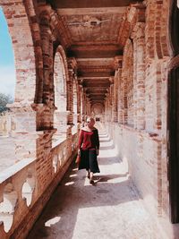 Full length of man standing in historic building