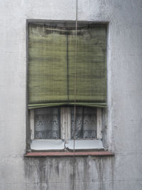 Closed window on wall of building