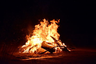 Bonfire on field at night